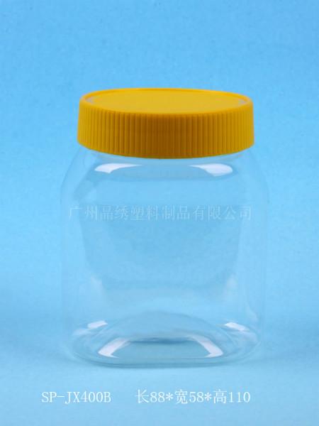 供应广州防盗盖塑料瓶休闲食品手提瓶果脯饯罐新款PET透明瓶